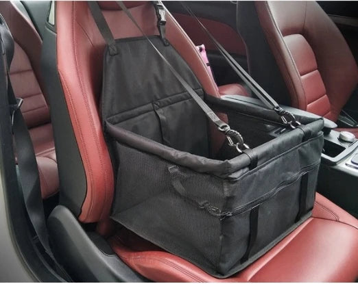Black pet car seat cover on a red car seat
