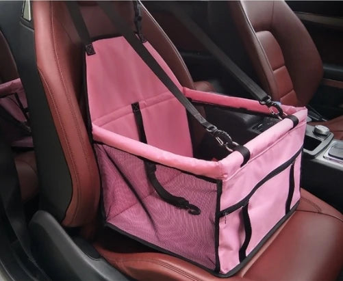 Pink pet seat cover on a car seat