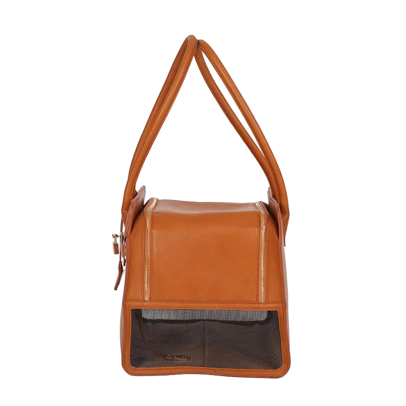 Brown leather pet carrier with mesh side on a white background