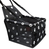 Black pet carrier with white paw prints on a white background
