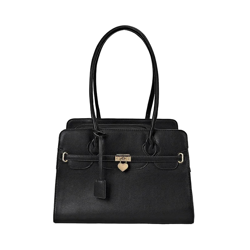 Black handbag with gold accents on a white background