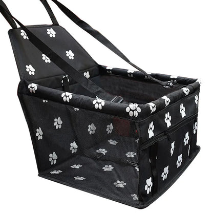 Black pet carrier with white paw prints on a white background
