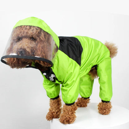 Dog wearing a bright green raincoat with a transparent hood on a white background