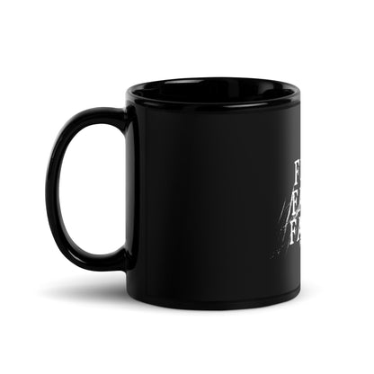Black mug with white text on a white background