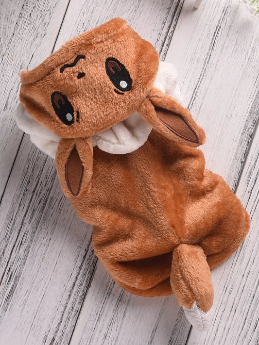 Brown plush toy resembling a rabbit on a wooden surface