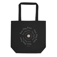 Black tote bag with paw print and text design on a white background