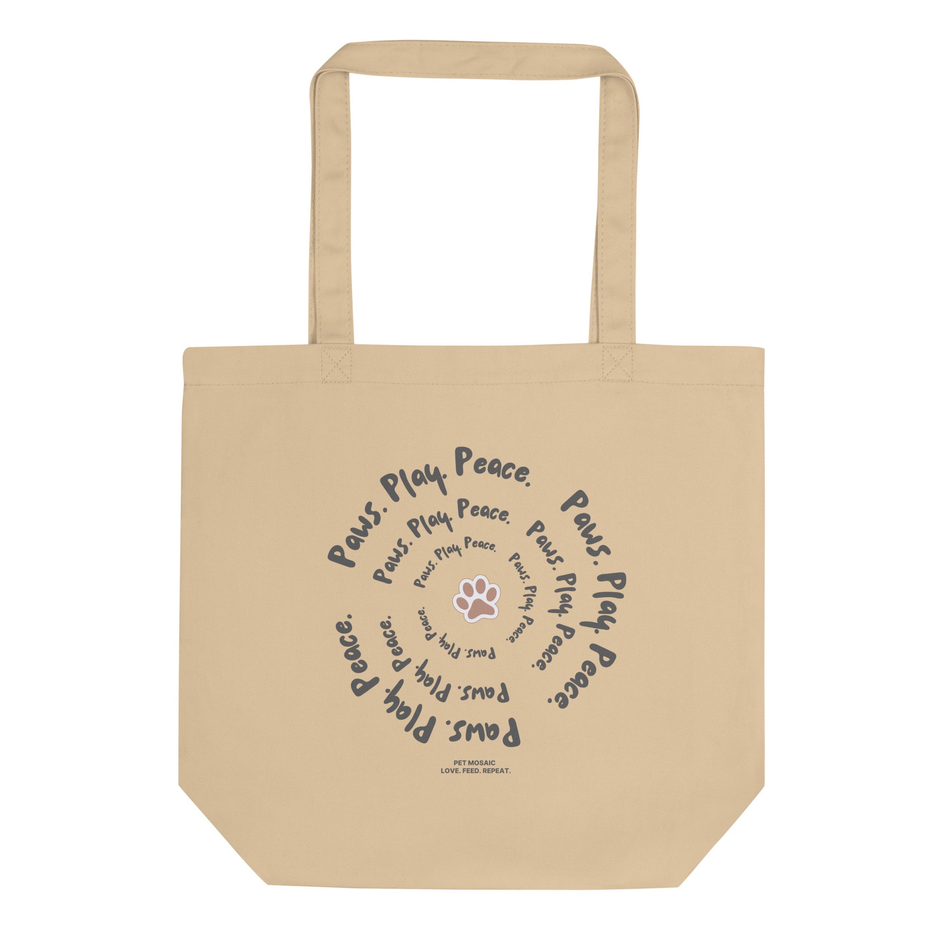 Beige tote bag with text and paw print design on a white background