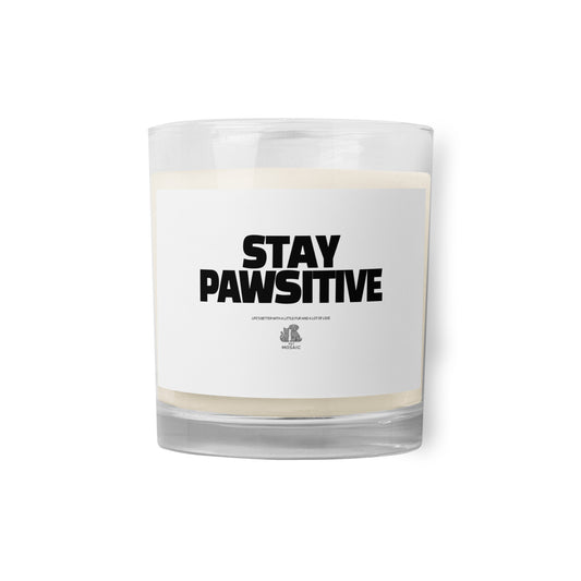 Candle with 'Stay Pawsitive' text on a white background
