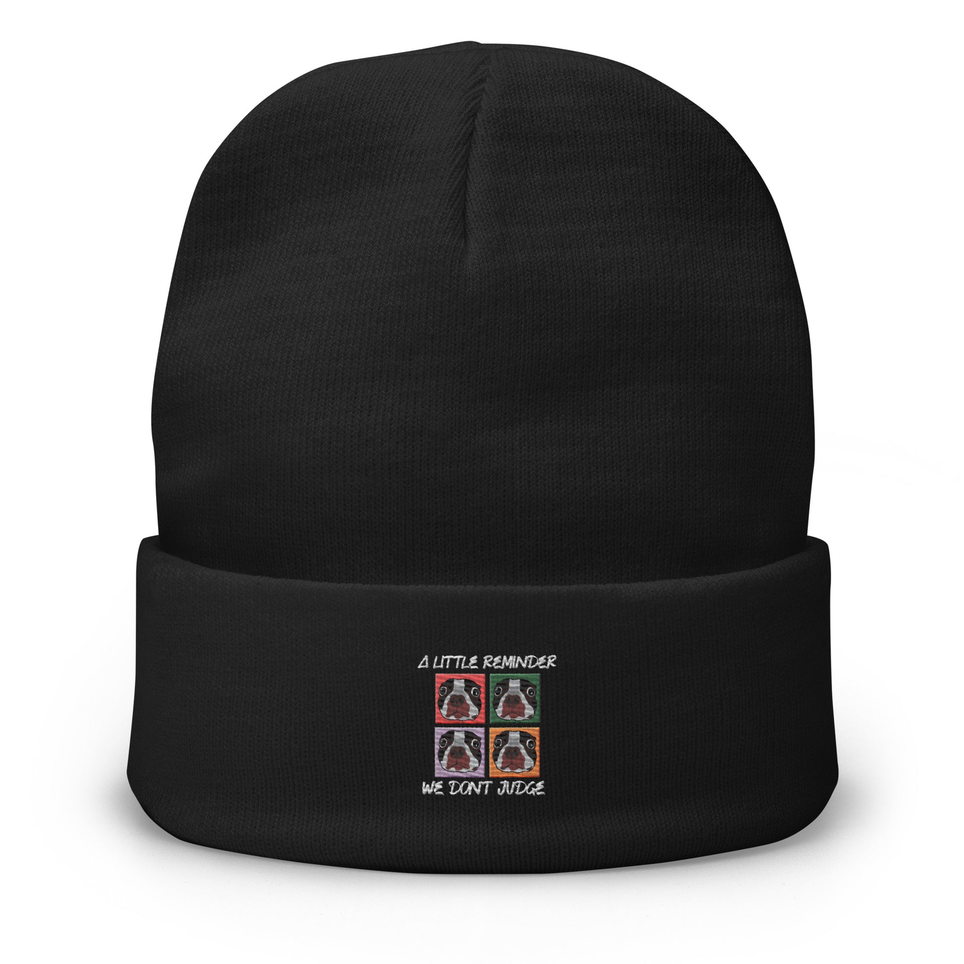 Black beanie with embroidered design on a white background
