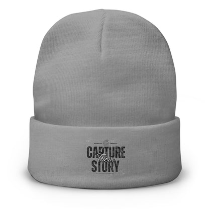 Gray beanie with 'Capture Their Story' text on a white background