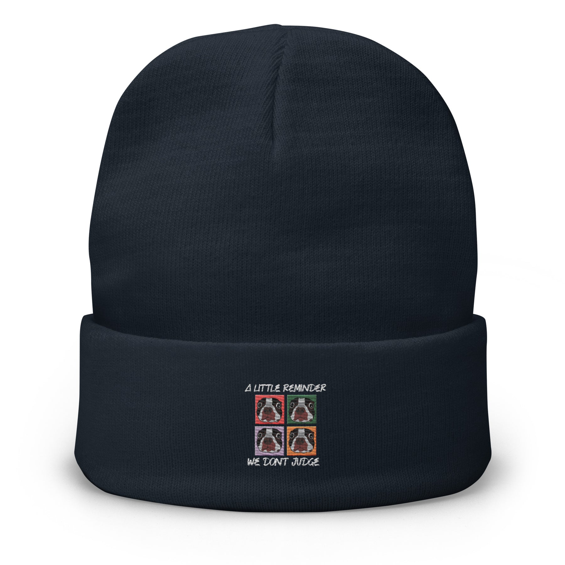 Black beanie with embroidered design on a white background