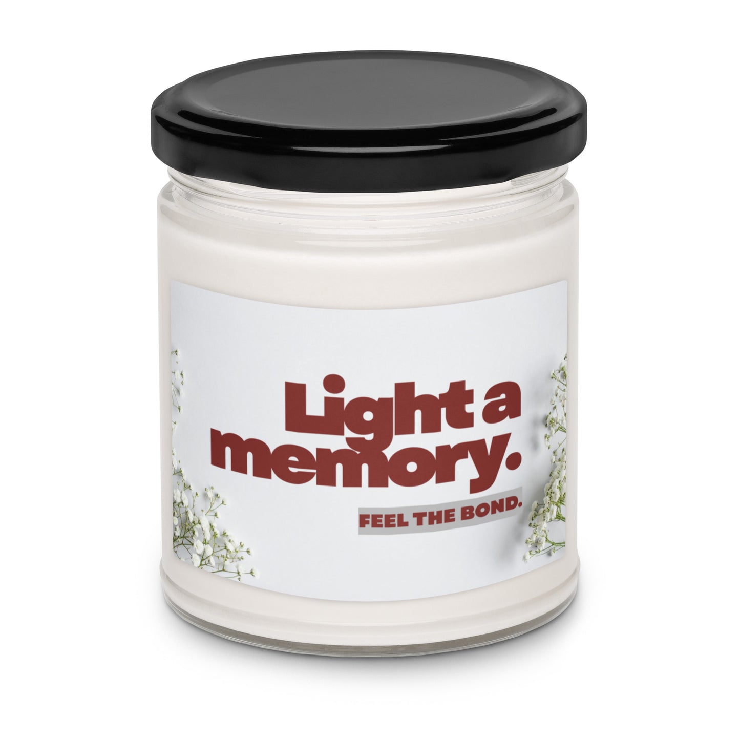 Candle jar with a label reading 'Light a memory. Feel the bond.' on a white background