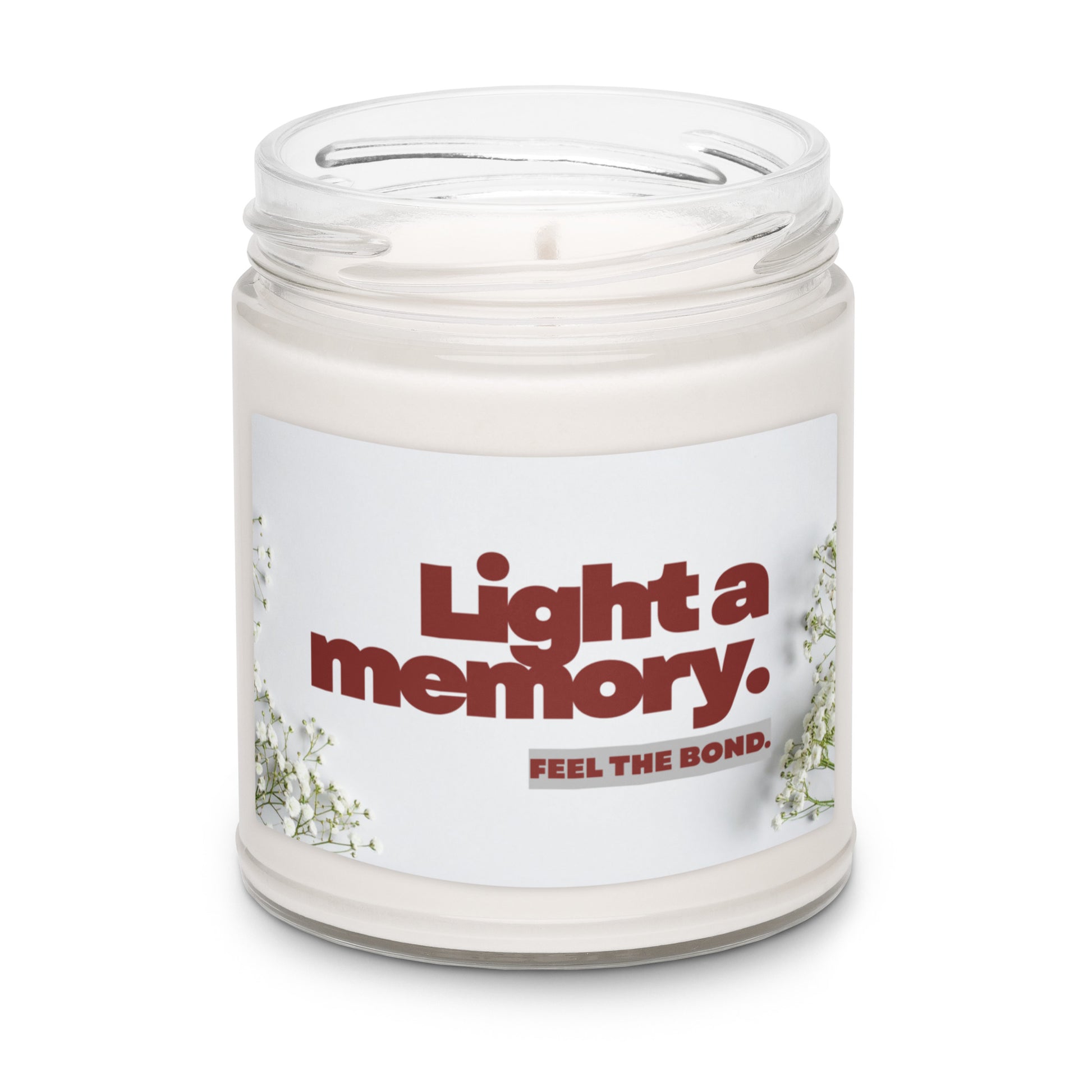 Candle in a jar with a label reading 'Light a memory. Feel the bond.' on a white background