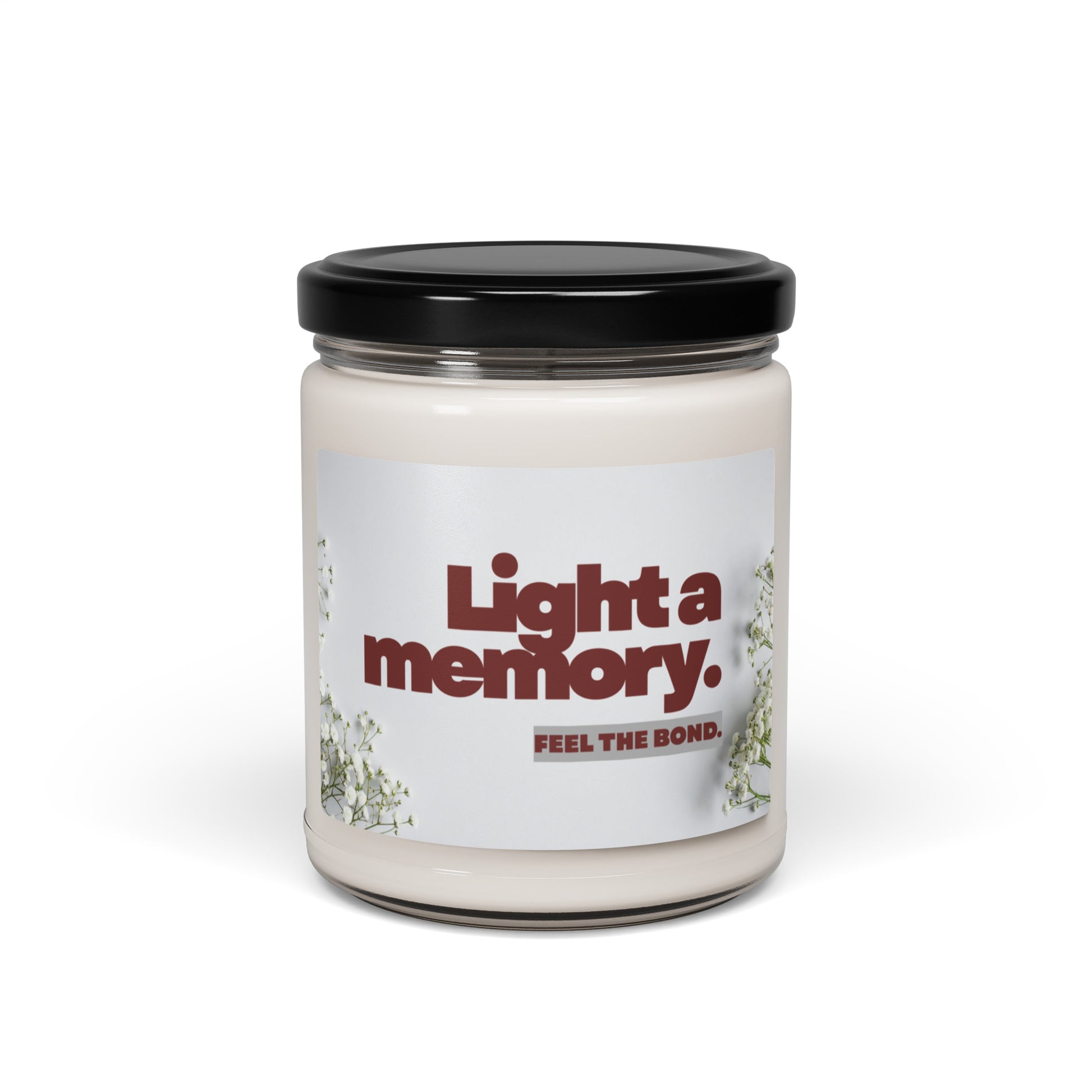 Candle jar with a label reading 'Light a memory. Feel the bond.' on a white background