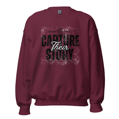 Maroon sweatshirt with 'Capture Their Story' text on a white background