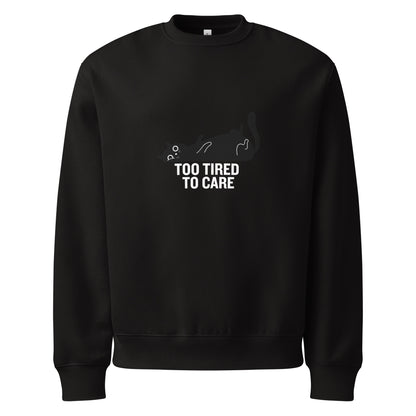 Black sweatshirt with a graphic and text 'Too Tired to Care' on a white background