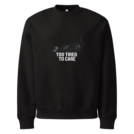 Black sweatshirt with a graphic and text 'Too Tired to Care' on a white background