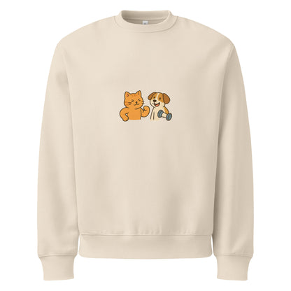Beige sweatshirt with a cat and dog graphic on a white background