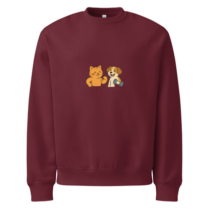 Maroon sweatshirt with a cat and dog graphic on a white background