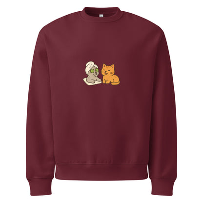Maroon sweatshirt with cartoon characters on a white background