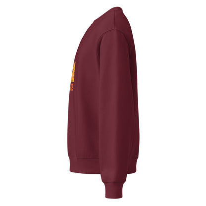Maroon sweatshirt with a logo on the sleeve against a white background
