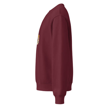 Maroon sweatshirt with a patch on the sleeve against a white background