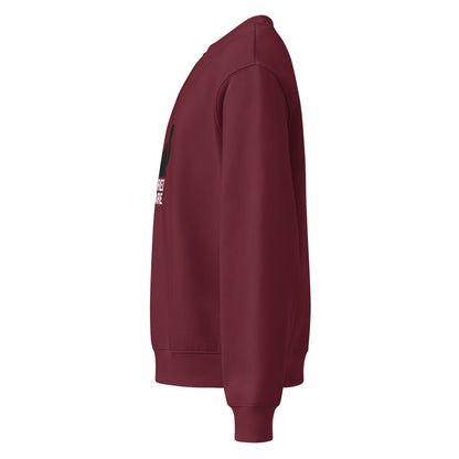 Maroon sweatshirt with a logo on the sleeve against a white background