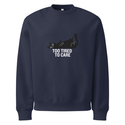 Navy blue sweatshirt with a cat graphic and 'Too Tired to Care' text on a white background