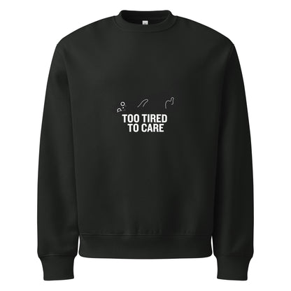 Black sweatshirt with 'Too Tired to Care' text on a white background