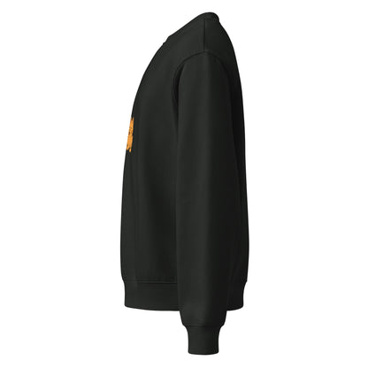 Black sweatshirt with a small yellow logo on the chest against a white background