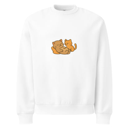 White sweatshirt with two orange cats embroidered on a white background