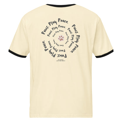 Beige t-shirt with black text and paw print design on a white background
