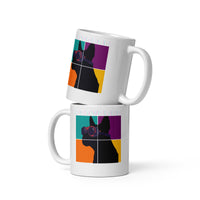 Two white mugs with colorful geometric design on a white background
