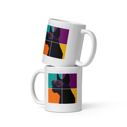 Two white mugs with colorful geometric design on a white background